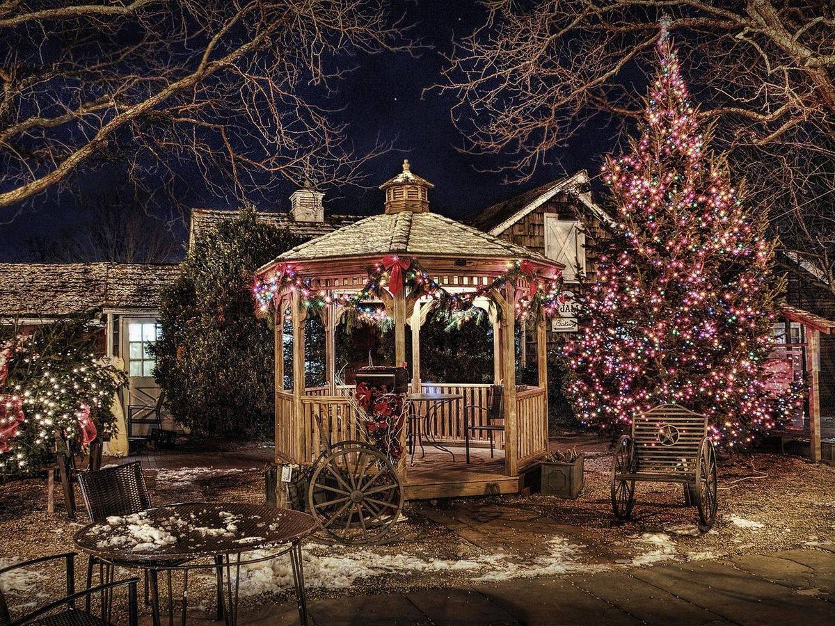 Wooden pavilion trimmed with warm lights at night